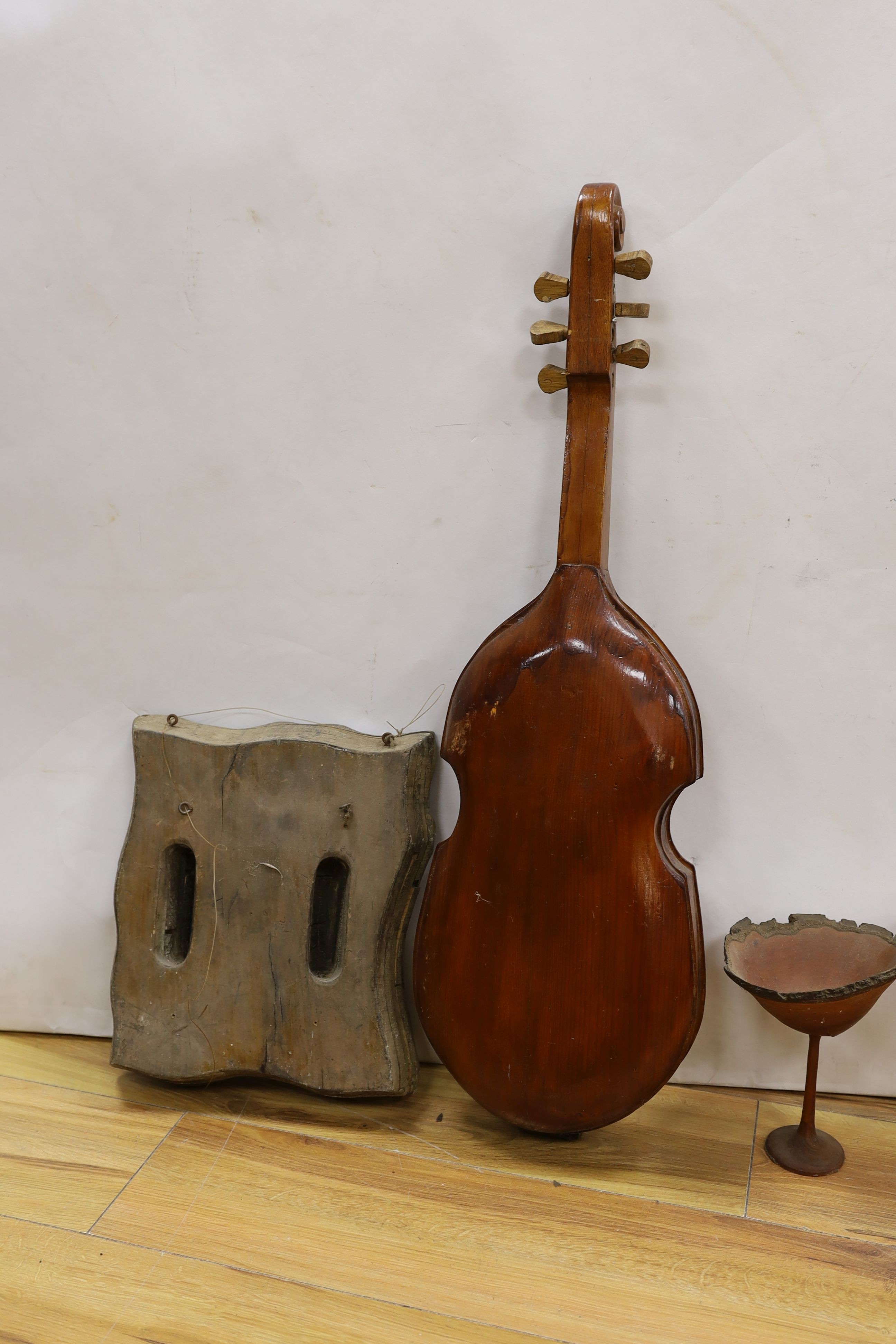 An Indian tile block, musical instrument etc